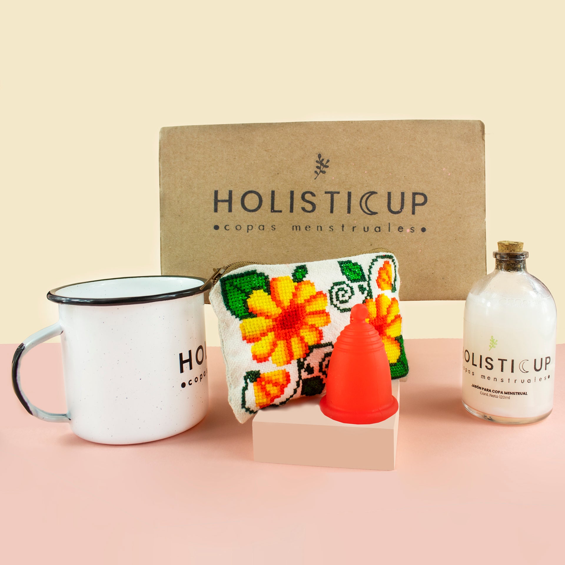 Tu kit para tu cuidado menstrual. Una taza para esterilizar tu copa menstrual, una copa menstrual del tamaño que necesites, un manual que te explica paso a paso sobre colocar tu copa. Un jabon para lavar tu copa menstural 